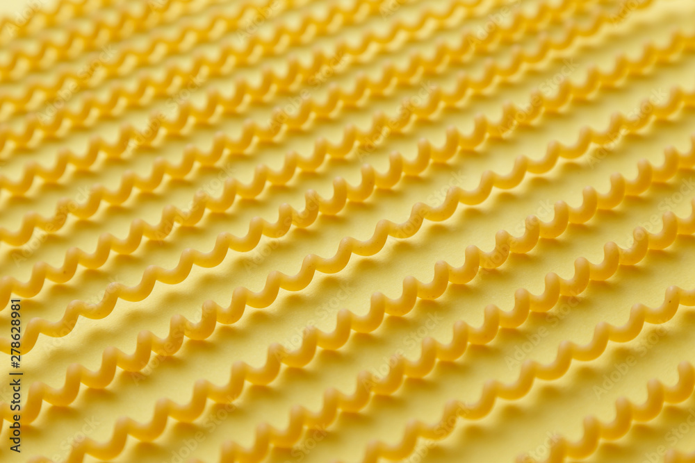 Raw fusilli lunghi pasta over yellow background.jpg Raw fusilli lunghi pasta over yellow background.jpg