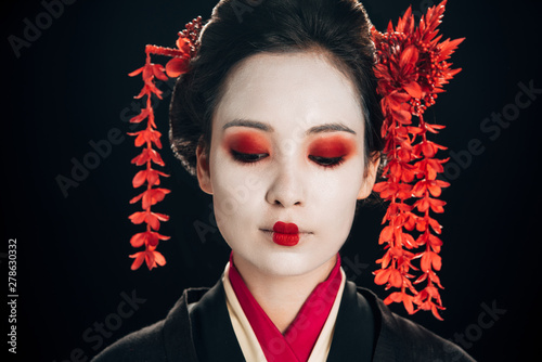 Canvas-taulu portrait of beautiful geisha with flowers in hair isolated on black