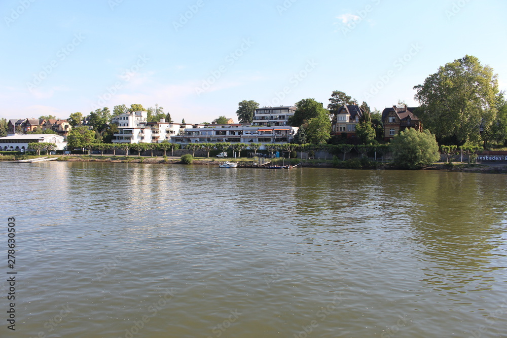 Houses on water on Rhine river in Wiesbaden Houses on water on Rhine river in Wiesbaden