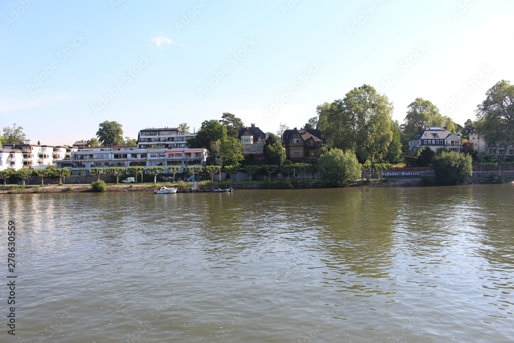 Houses on water on Rhine river in Wiesbaden Houses on water on Rhine river in Wiesbaden