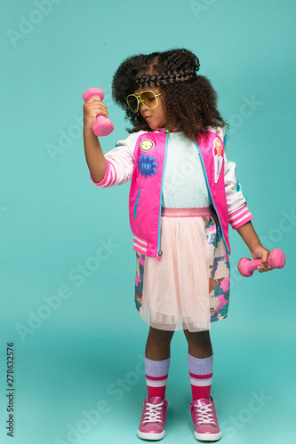 Portrait of girl in workout clothes and tutu