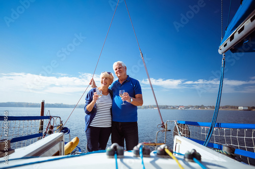 Couple relaxing in sailboat during summer vacation
