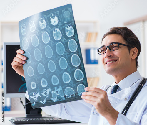Doctor radiologist looking at x-ray images