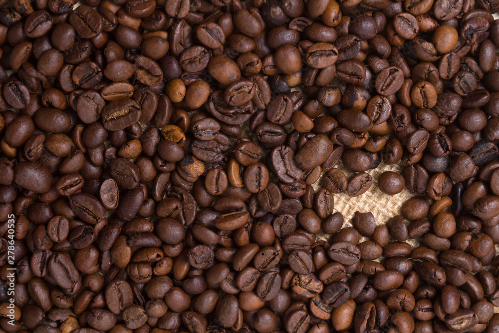 Coffee grains fall in closeup. Food and Drink Coffee grains fall in closeup. Food and Drink