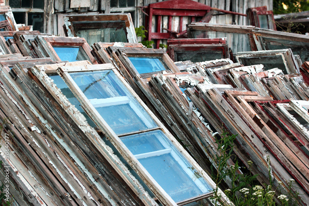Piles of old wooden frames and windows