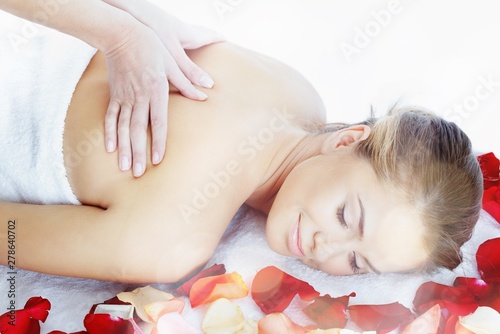 Beautiful young woman relaxing with massage