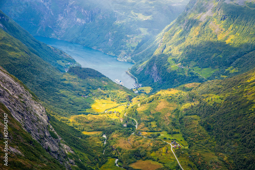 View to the Geiranger fjord with green valley surrounded by mountains, Geiranger, Sunnmore region, More og Romsdal county, Norway