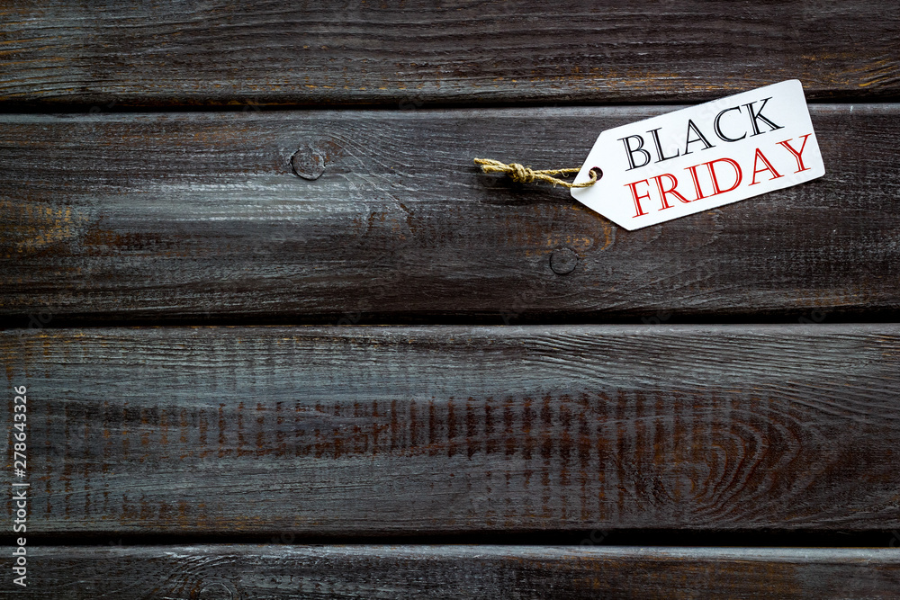 Black friday labels on wooden background top view mockup