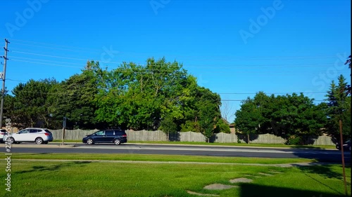 Side View of City Traffic Jam.  Urban Landscape With Car Vehicles Slowing Down to Stop in Summer Day.