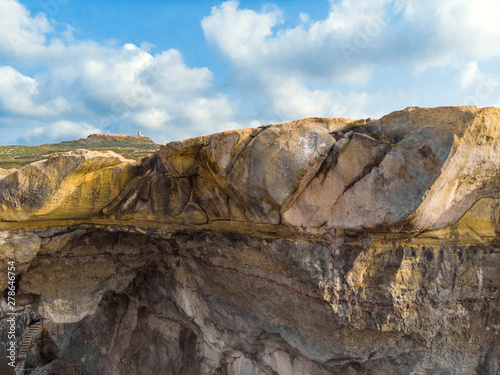 Aerial landscape of Gozo island. Wied il-Mielah. Natural arch, lighthouse. Malta 