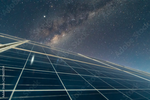 Solar Energy Panels view, a nice technology blue pattern at Atacama Desert arid lands. The solar modules going to the infinity with the Milky Way trying to get energy from the stars on the night sky 