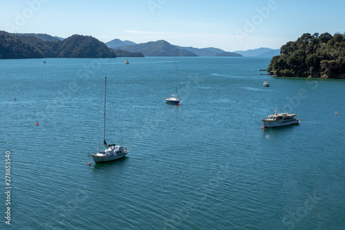 Yachts and sail boats moored in the bays in the Marlborough Sounds New Zealand © Stewart