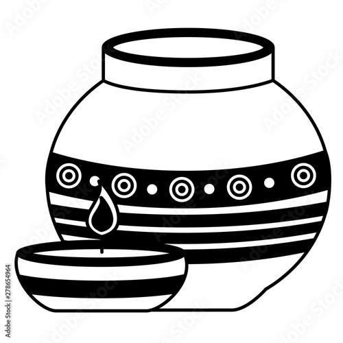 indian ceramic pot with candle flame
