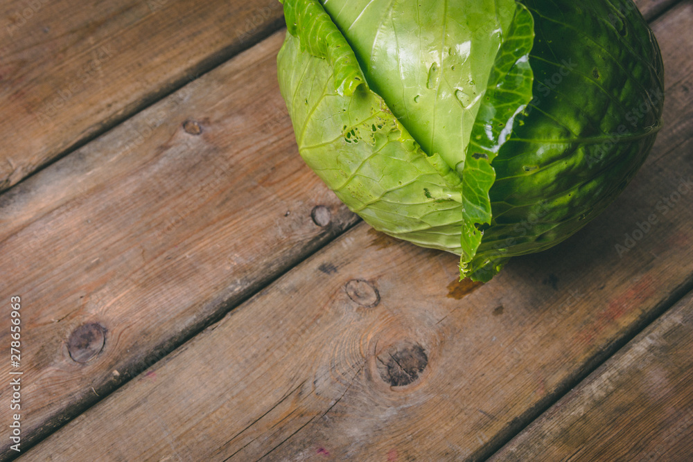 Fresh Cabbage on a wooden rustic table. Copy space. Healthy food. Raw Vegetables. Fresh Cabbage on a wooden rustic table. Copy space. Healthy food. Raw Vegetables.
