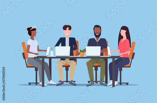 businesspeople working on laptops during training conference meeting mix race people team sitting at round table teamwork brainstorming concept flat full length horizontal