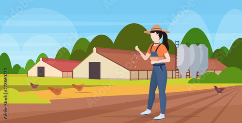 woman farmer feeding chicken free range poultry breeding farming agriculture concept barn building countryside landscape background flat full length horizontal