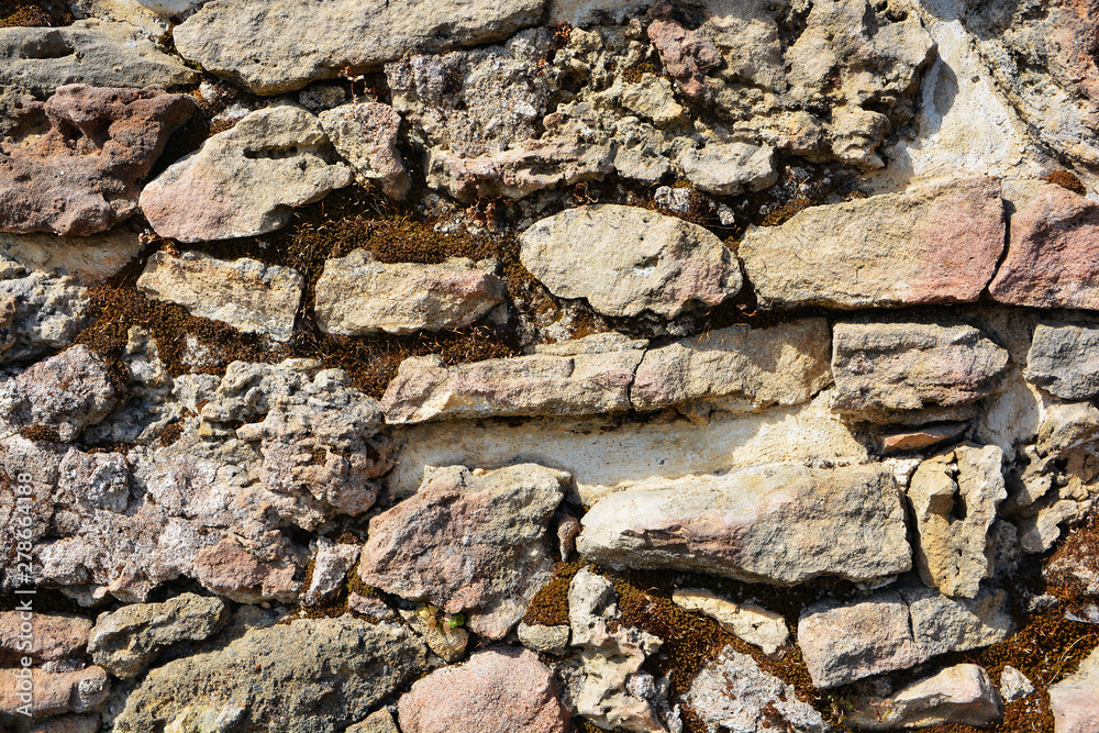 Masonry stone wall in the ancient city of side in Turkey. Natural stone background
