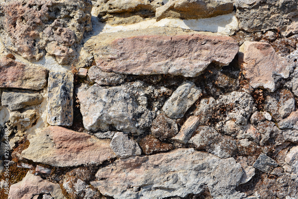 Masonry stone wall in the ancient city of side in Turkey. Natural stone background Masonry stone wall in the ancient city of side in Turkey. Natural stone background