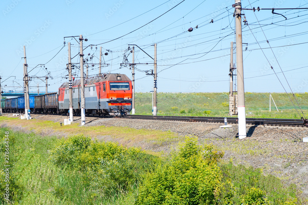 Freight train moving slowly along the railway track