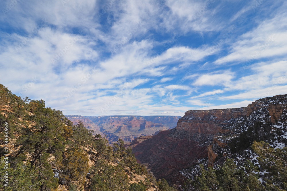 Winter canyon view under a brilliant cloudscape from the Bright Angel Trail in Grand Canyon National Park, Arizona.
