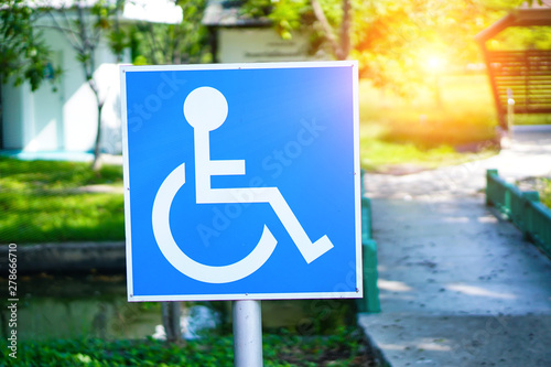 Blue Handicap at parking car sign outdoors for Disabled, Wheelchair or elder old or cannot self help people