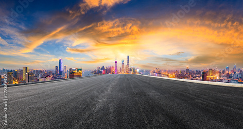 Empty asphalt highway and modern city skyline in Shanghai at sunset,China © ABCDstock