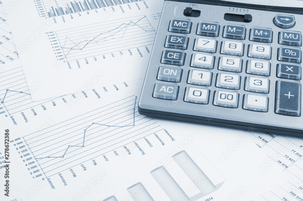 Calculator on financial documents, business concept Calculator on financial documents, business concept