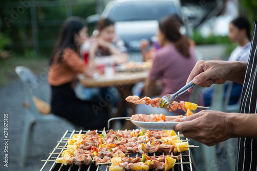 Barbeque Grill Street Food in thailand,Eat outdoors in a happy family. holiday celebration concept