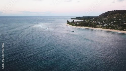 Drone Shot flying over surfers off of the North Shore Coast of Oahu, Hawaii. photo