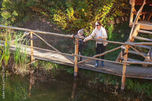 Fototapeta Naklejka Na Ścianę i Meble -  Woman and boy catching fish for bait