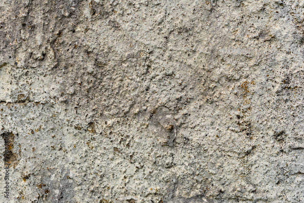 Texture of a concrete wall with cracks and scratches which can be used as a background Texture of a concrete wall with cracks and scratches which can be used as a background