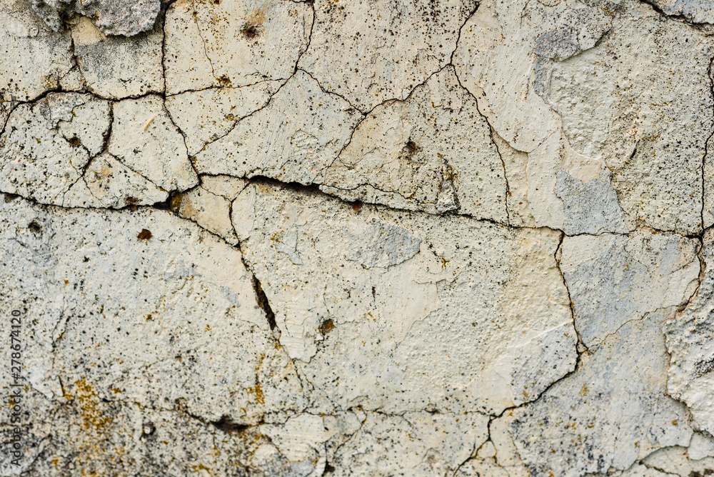 Obraz premium Texture of a concrete wall with cracks and scratches which can be used as a background