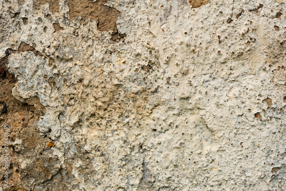 Texture of a concrete wall with cracks and scratches which can be used as a background Texture of a concrete wall with cracks and scratches which can be used as a background