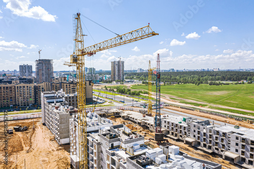 construction of new multistory apartment buildings. aerial view. blue sky background
