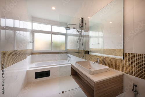 Interior of Modern bathtub bathroom and sink interior in a hotel.