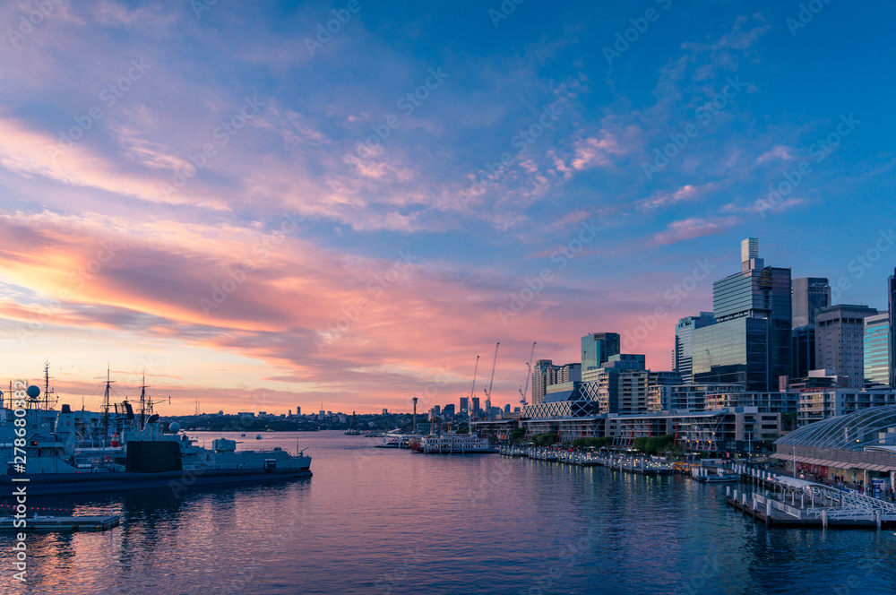 Sunset view over Sydney Harbour and business office buildings