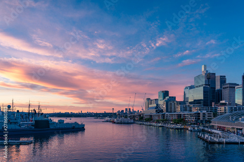 Sunset view over Sydney Harbour and business office buildings © Olga K