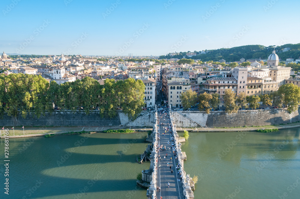Castle of the Holy Angel bridge with people and Rome historic centre