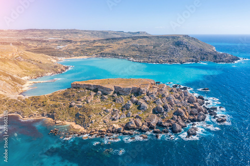 Gnejna and Ghajn Tuffieha bay on Malta island. Aerial view from the height of the coastlinescenic sliffs near the mediterranean turquoise water sea. photo