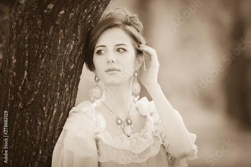 Young redhead girl in Victorian era clothes photo