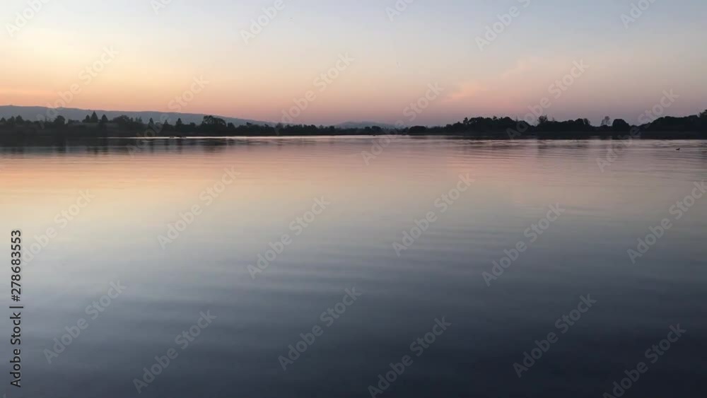 A meditative and calming video of a lake during twilight. A meditative and calming video of a lake during twilight.