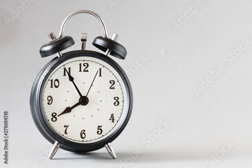 Black old style alarm clock 
