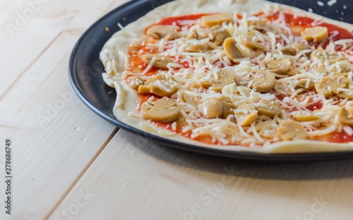 Italian food culture wiht snack on a wooden table.Delicious freshly baked in the stone oven fresh pizza.
