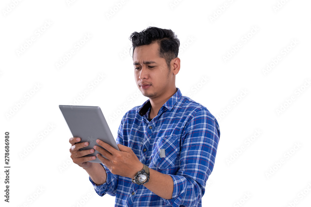 portrait of asian young man looking at digital tablet with isolated background portrait of asian young man looking at digital tablet with isolated background