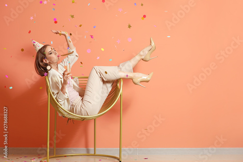 Happy woman with party whis...