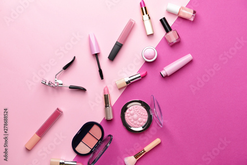 Set of makeup cosmetics on color background