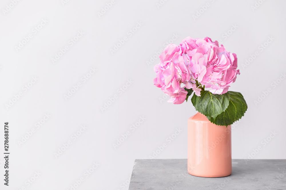 Vase with beautiful hydrangea flowers on table Vase with beautiful hydrangea flowers on table