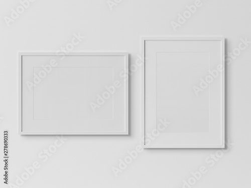 White rectangular frames hanging on a white wall mockup 3D rendering
