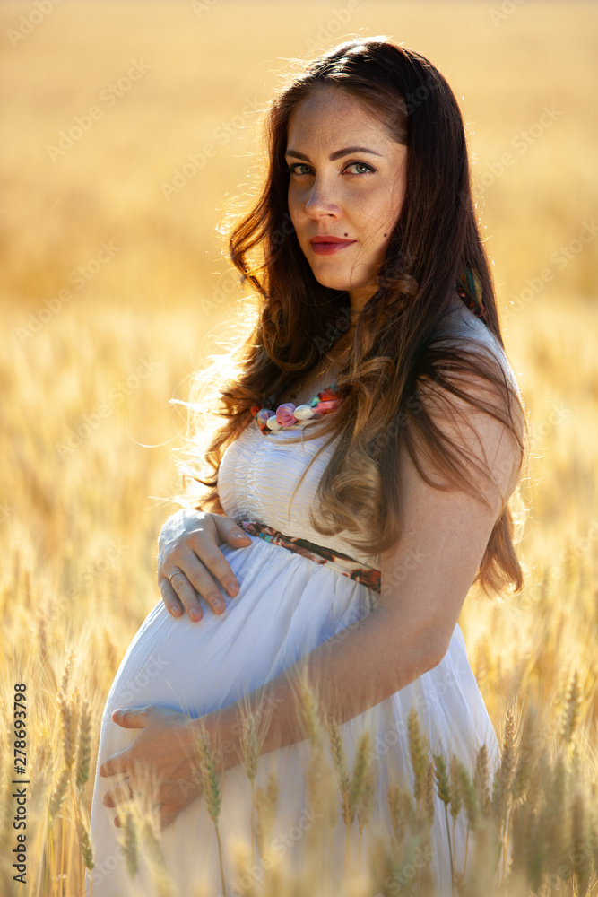 pregnant woman on nature field pregnant woman on nature field