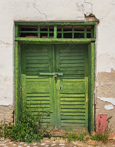 Old green wooden door in Hu...